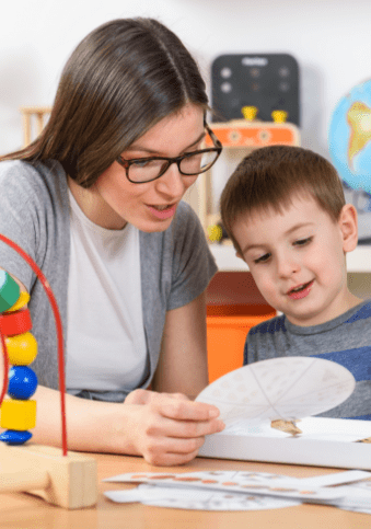 Teacher teaching child