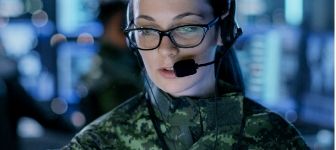 A woman wears a headset and gives instructions after learning what you can do with an emergency degree.