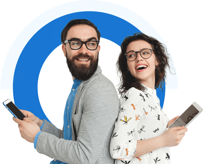 A man and a woman standing back to back each holding a mobile device.