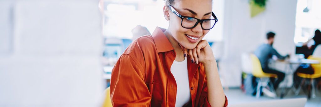 A happy female student working.