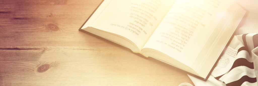 The torah laying on a table.