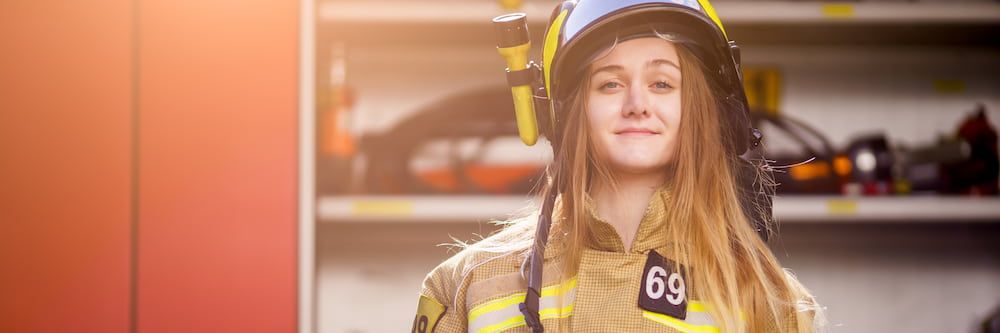 Female fire fighter in the fire station.